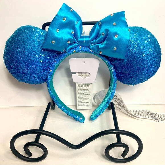 Disney Accessories - NWT. Disney blue teal sequin Minnie ears with a blue bow